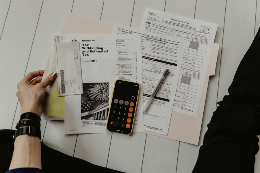Calculator, financial records and accounting paperwork