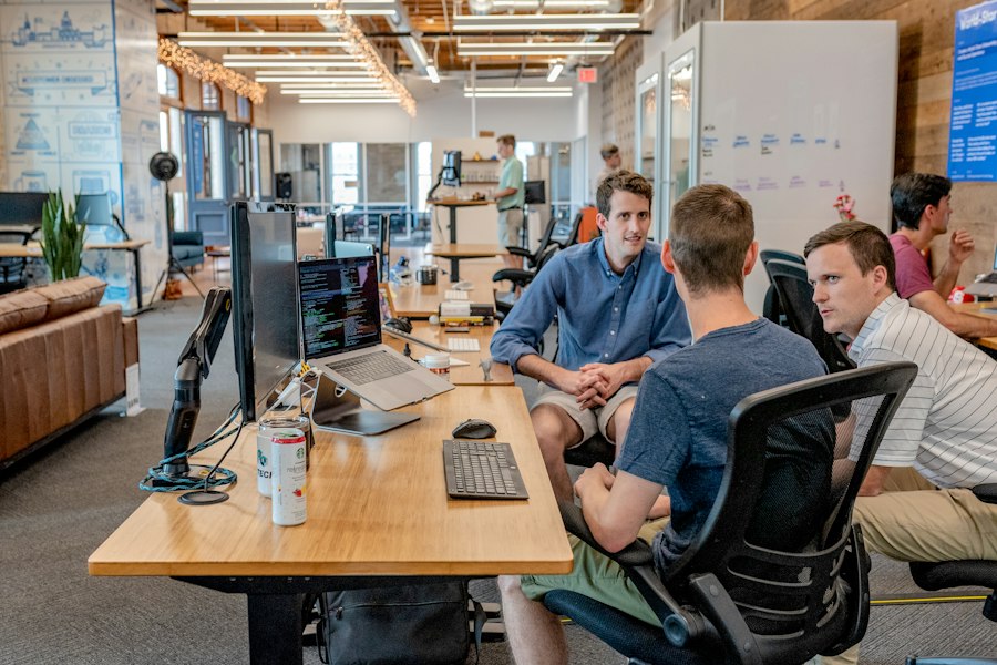 People working together to solve a business technology problem
